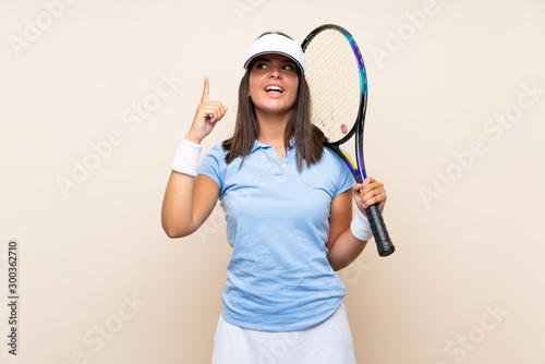 Young woman playing tennis over isolated background intending to realizes the solution while lifting a finger up