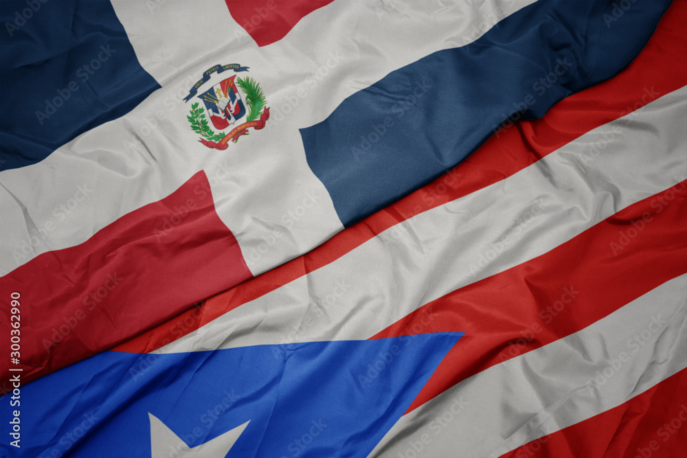 waving colorful flag of puerto rico and national flag of dominican  republic. foto de Stock | Adobe Stock