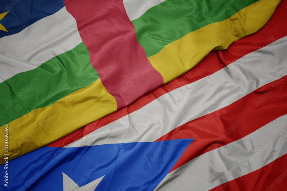 waving colorful flag of puerto rico and national flag of central african republic.