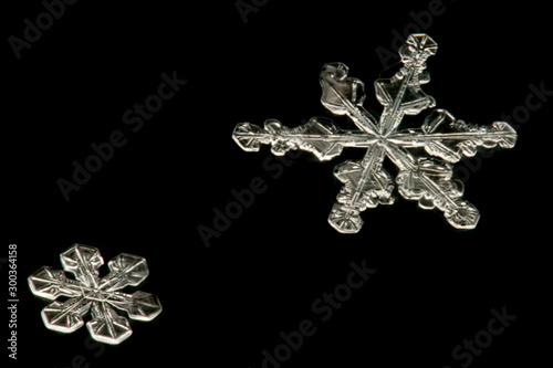 real snowflakes on a black background