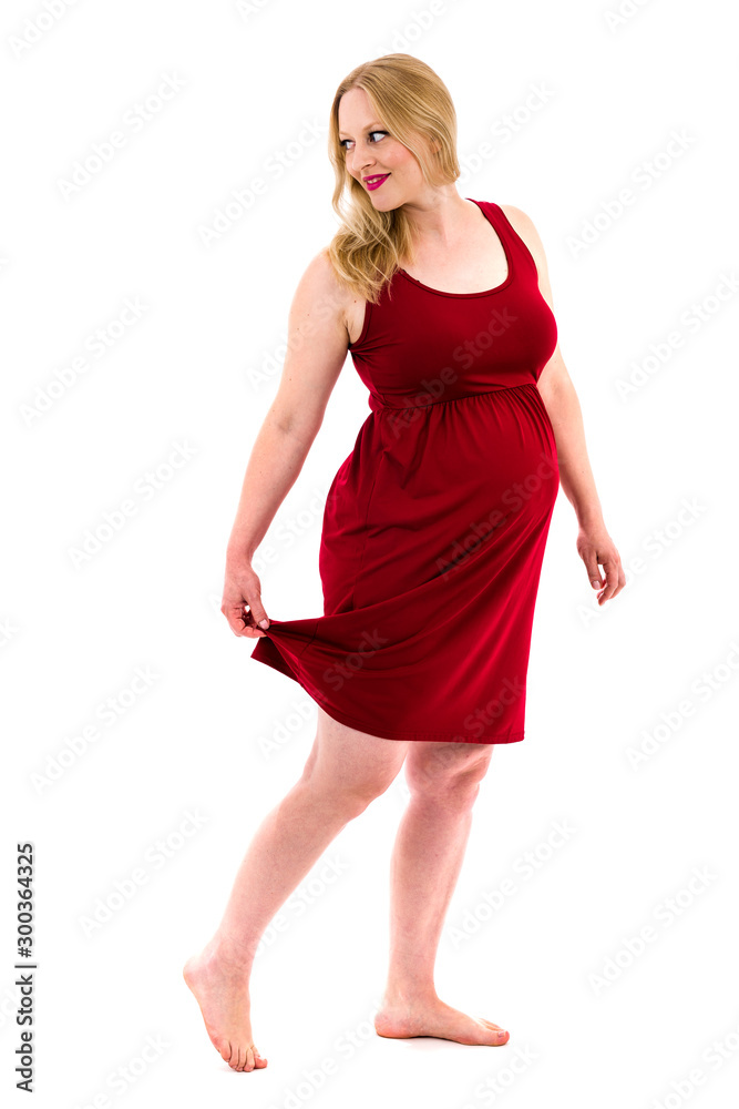 Pregnant woman in red dress holding belly on white background. Pregnant woman in red dress holding belly on white background.