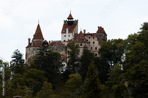 Famous Dracula castle Bran as seen from the distance during a summer day (Bran, Romania, Europe)