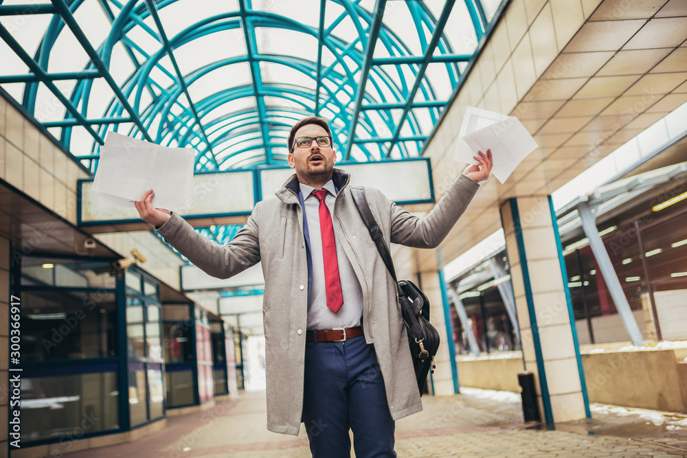 Business man celebrating by throwing papers in the air Business man celebrating by throwing papers in the air