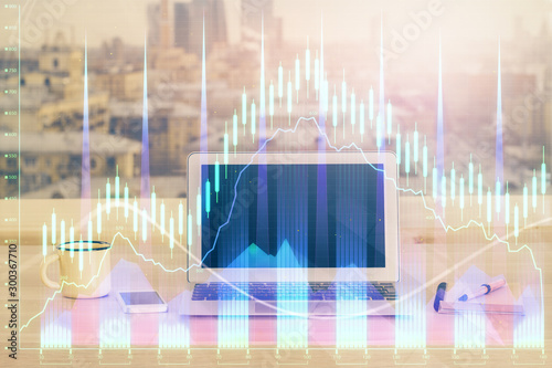 Financial market graph hologram and personal computer on background. Multi exposure. Concept of forex.