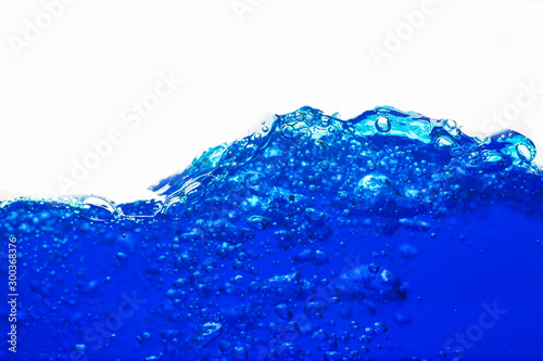 Close up blue Water splash with bubbles on white background