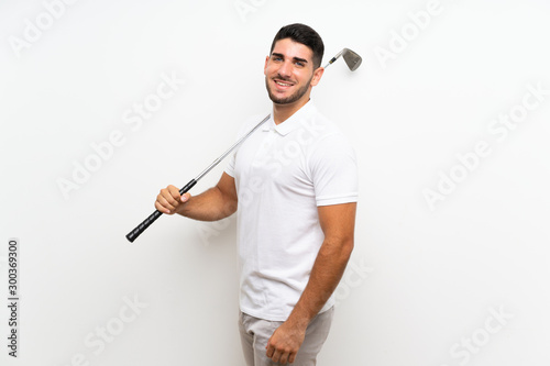 Handsome young golfer player man over isolated white background