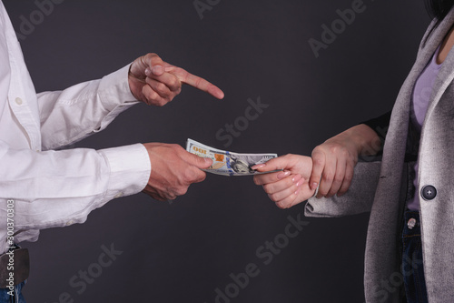 Cuadro en lienzo Official woman get bribe from a man but caught in action by other person close up