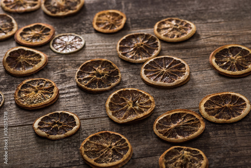 dried citrus slices on wooden brown surface