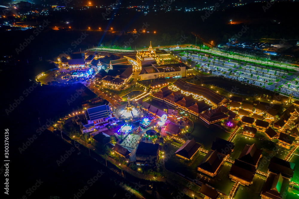 Obraz premium Aerial view of Legend Siam with symphony light show at night, Pattaya Thailand. Select focus.