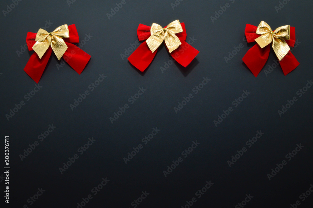 decorative bows on a plain background. red and gold bows. decorative bows on a plain background. red and gold bows.