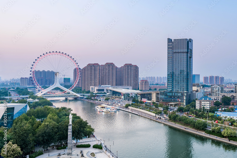 Twilight scenery of Haihe River and Ferris wheel in Tianjin, China