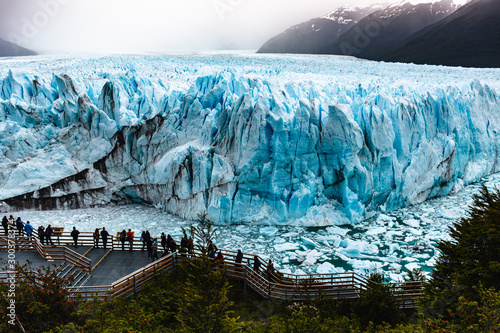 People walking close to Glaciar Perito Moreno in Patagonia Argentina El Calafate