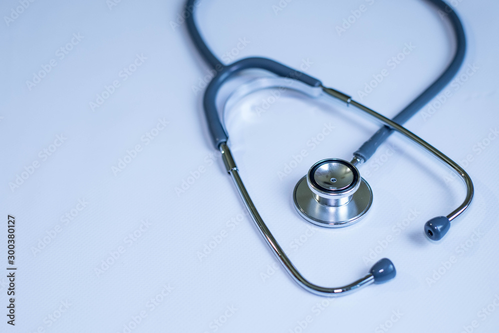 Medicine and health concept. Stethoscope on blue background close up Medicine and health concept. Stethoscope on blue background close up