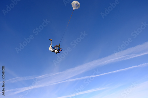 Skydiving. Tandem jump. People in the sky.