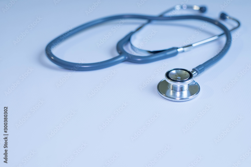 Medicine and health concept. Stethoscope on blue background close up Medicine and health concept. Stethoscope on blue background close up