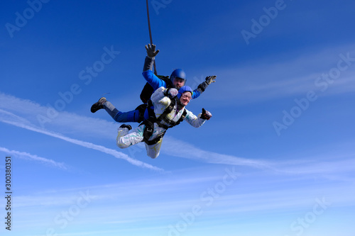 Skydiving. Tandem jump. People in the sky. © Sky Antonio
