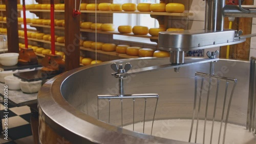Process of cheesemaking with rotating mixer closeup