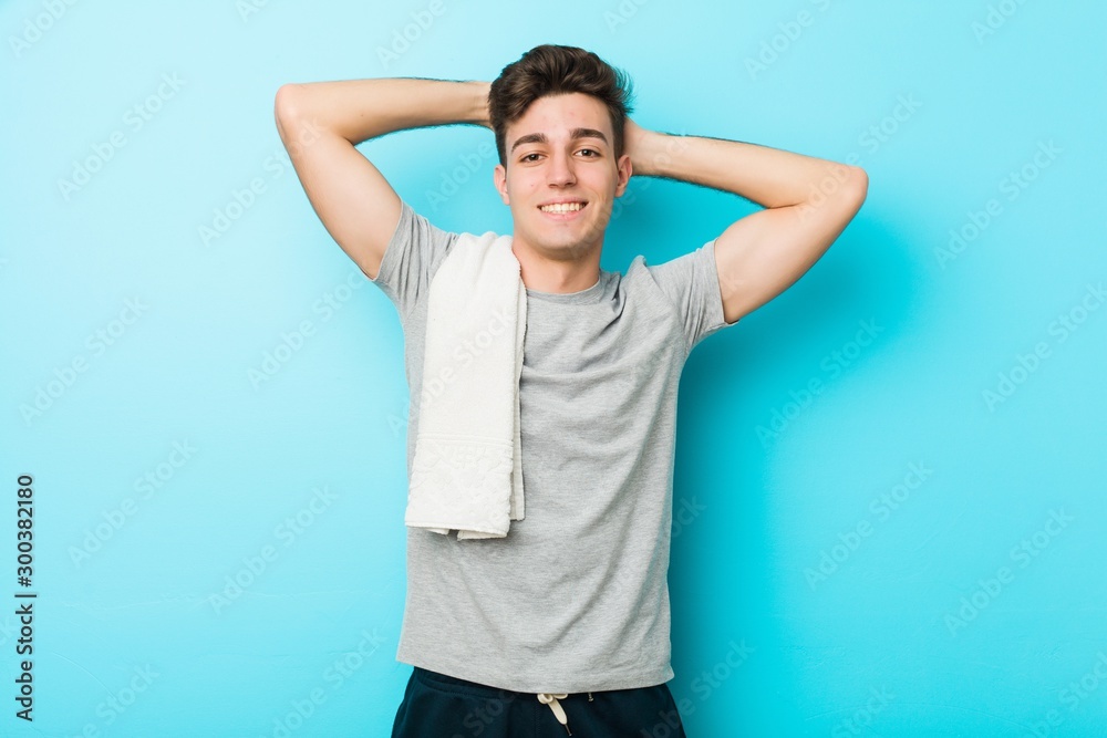 Young fitness teenager man stretching arms, relaxed position. Young fitness teenager man stretching arms, relaxed position.