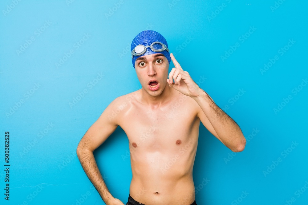 Young swimmer man having an idea, inspiration concept.