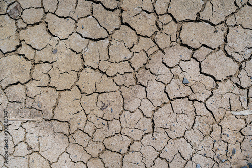Beautiful texture of cracked dry ground in the countryside background.