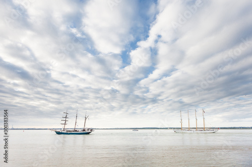 Tall ships Atlantis and Santa Maria Manuela sailing past Le Havre, Seine Estuary, Armada 2019, Normandy, France photo