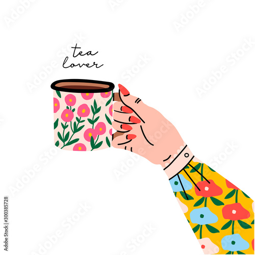 Tea lover. Female hand holding cup or mug with tea. Side view. Flower print on sleeve and cup. Hand drawn colored trendy vector illustration. Cartoon style. Flat design. Isolated on a white background