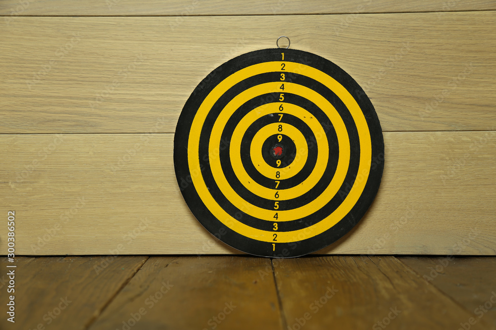 A dart board is standing on the table A dart board is standing on the table