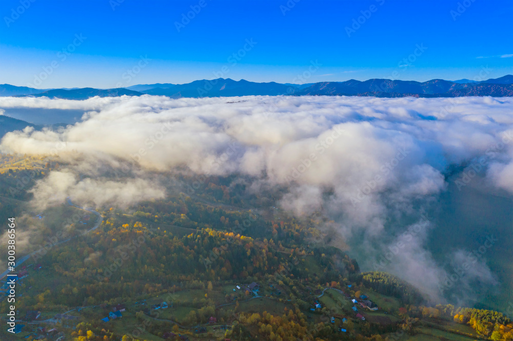 Mist clouds over mountain valley Mist clouds over mountain valley