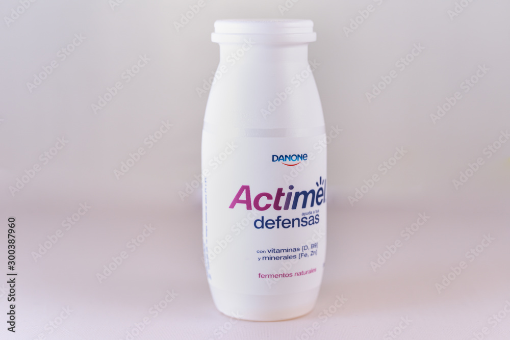 Barcelona, Spain. November 2019: Bottle of Actimel probiotic yogurt type  drink. Produced by the French company Danone Photos | Adobe Stock