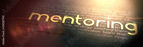 Macro Photo of Gold Slogan MENTORING. Golden Word Mentoring embossed on dark paper. Great business concept with warm dramatic lighting and light artifacts.