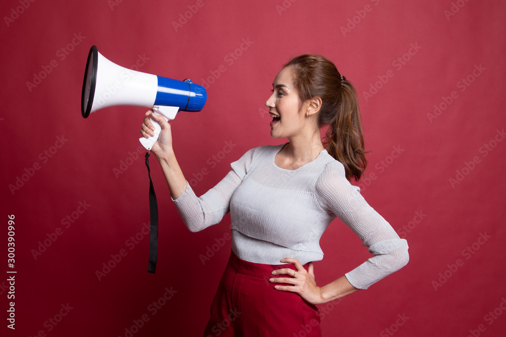 Beautiful young Asian woman announce with megaphone. Beautiful young Asian woman announce with megaphone.