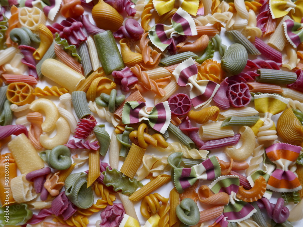 Colorful Pasta, Loop Noodles, Italian Pasta, Farfalle, Fussili and others. Background, close-up, format-filling.