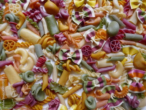 Colorful Pasta  Loop Noodles  Italian Pasta  Farfalle  Fussili and others. Background  close-up  format-filling.