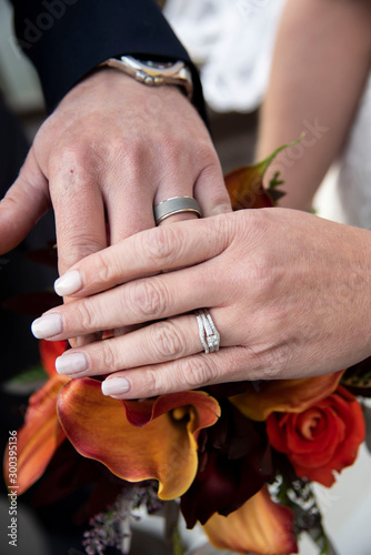 bride and groom holding hands