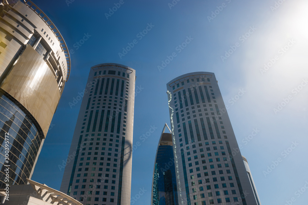Obraz premium Skyscrapers and modern office buildings at downtown of Doha city on clear sky background. Doha, Qatar