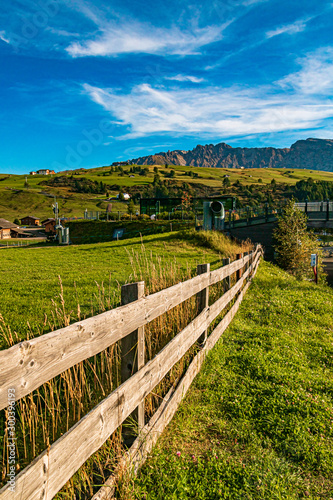 Beautiful alpine view with a wooden fence at the famous Seiser Alm, South Tyrol, Italy
