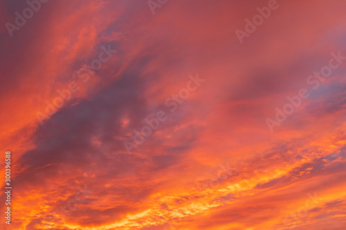 Dramatic fiery sky sunset cloudscape at dusk