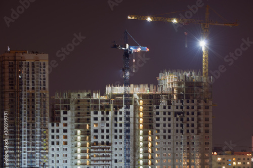 High-rise building under construction in the dark