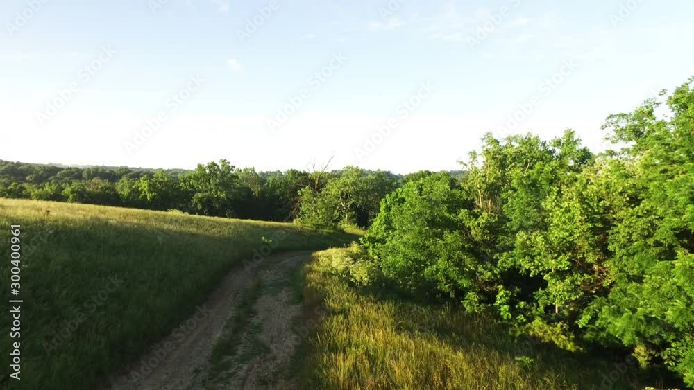 Wide aerial, trail through Indiana farmland Wide aerial, trail through Indiana farmland