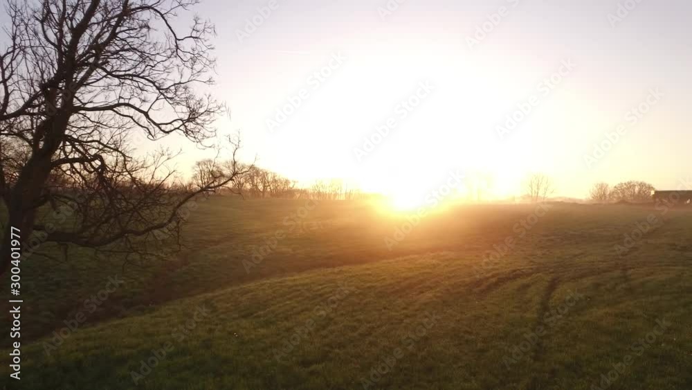 Sunset over Indiana field, wide aerial Sunset over Indiana field, wide aerial