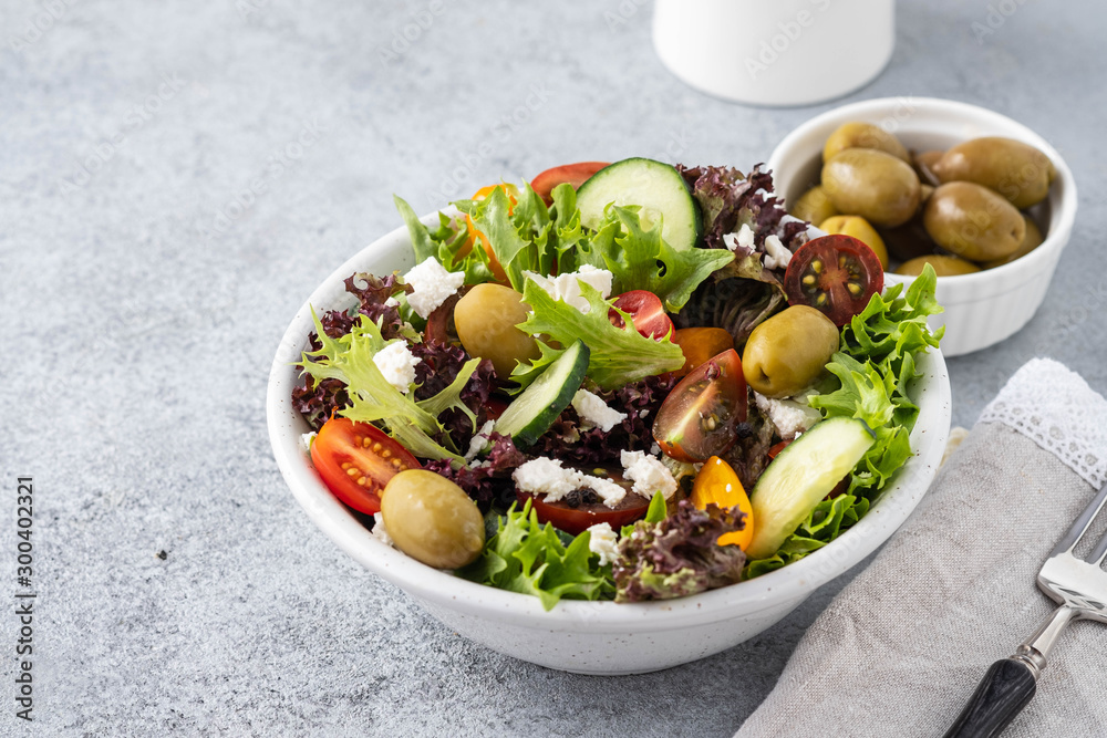 Salad of fresh vegetables and herbs with olives and feta cheese. Salad of fresh vegetables and herbs with olives and feta cheese.