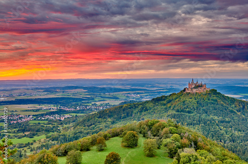Wallpaper Mural Hilltop Hohenzollern Castle on mountain top at sunset in Swabian Alps, Baden-Wur