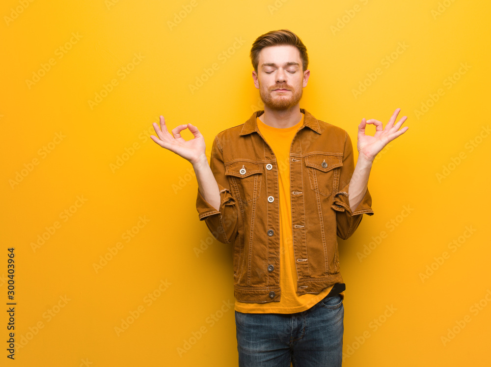 Young redhead man performing yoga Young redhead man performing yoga