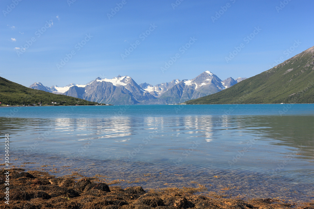 Landscape on the glacier from shore of a norvegian fiord in a sunshine summer day Landscape on the glacier from shore of a norvegian fiord in a sunshine summer day