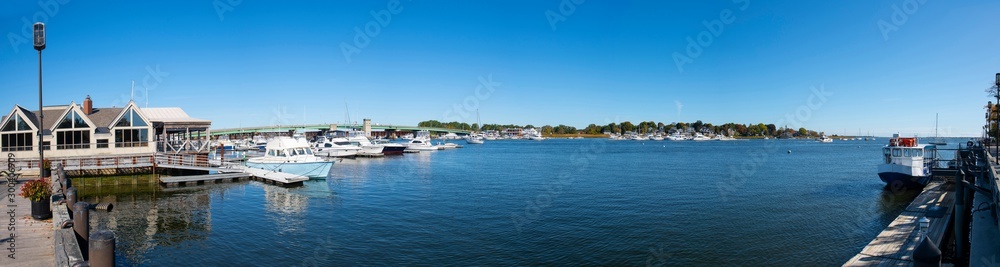 Yachts at pier on Merrimack River panorama in downtown Newburyport, Massachusetts, MA, USA.
