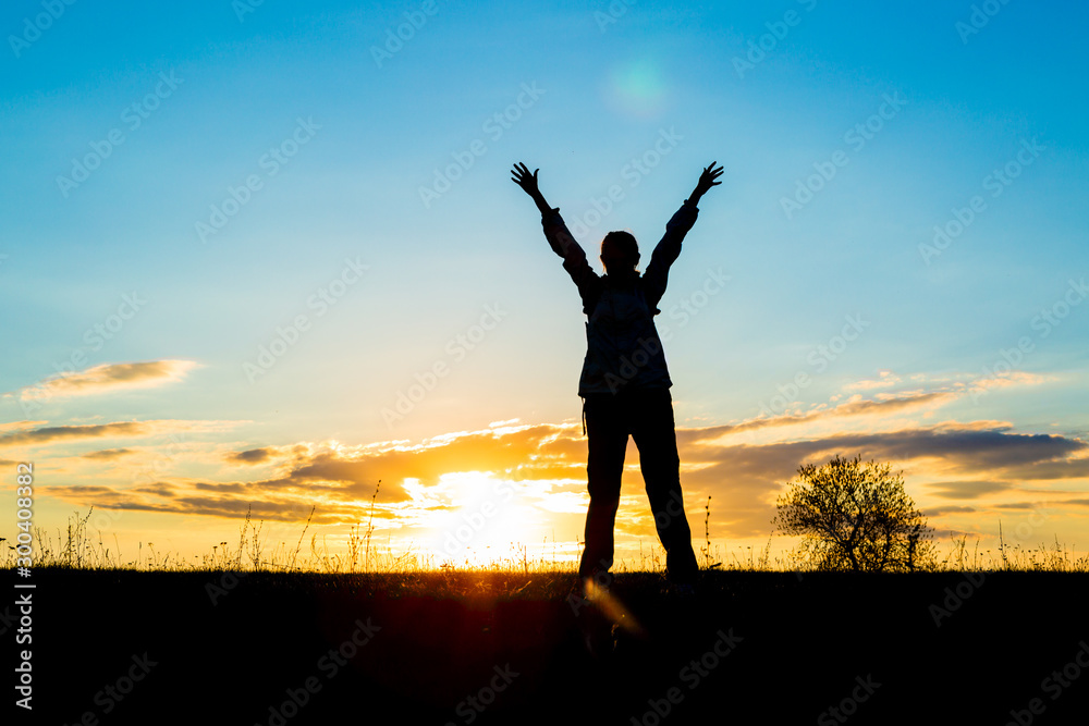 arms raised up above her head.