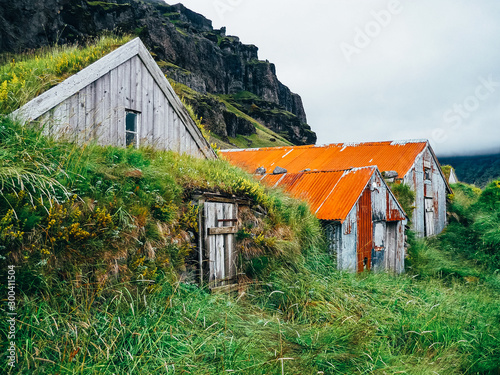 Typical wooden houses in Nupstadur in Iceland with moody weather