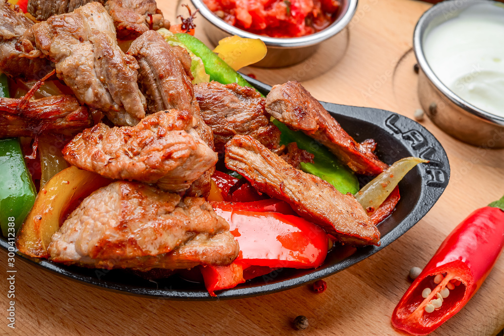 Fried meat with different vegetables with sauce Fried meat with different vegetables with sauce