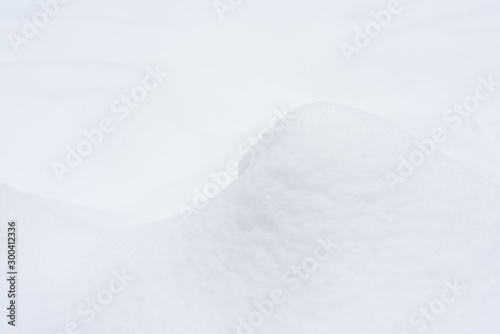Fragment of an elegant snow dune. Christmas background.