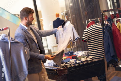 Φωτογραφία Man shopping in menswear store